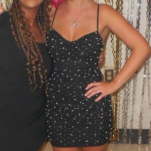 Size small, black sparkly, adjustable straps, built in bra thigh length dress